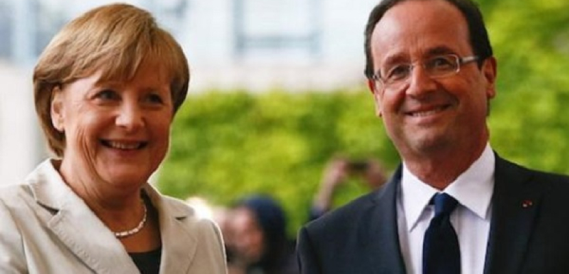 ميركل وأولاند يتفقان على عقد قمة لزعماء منطقة اليورو
